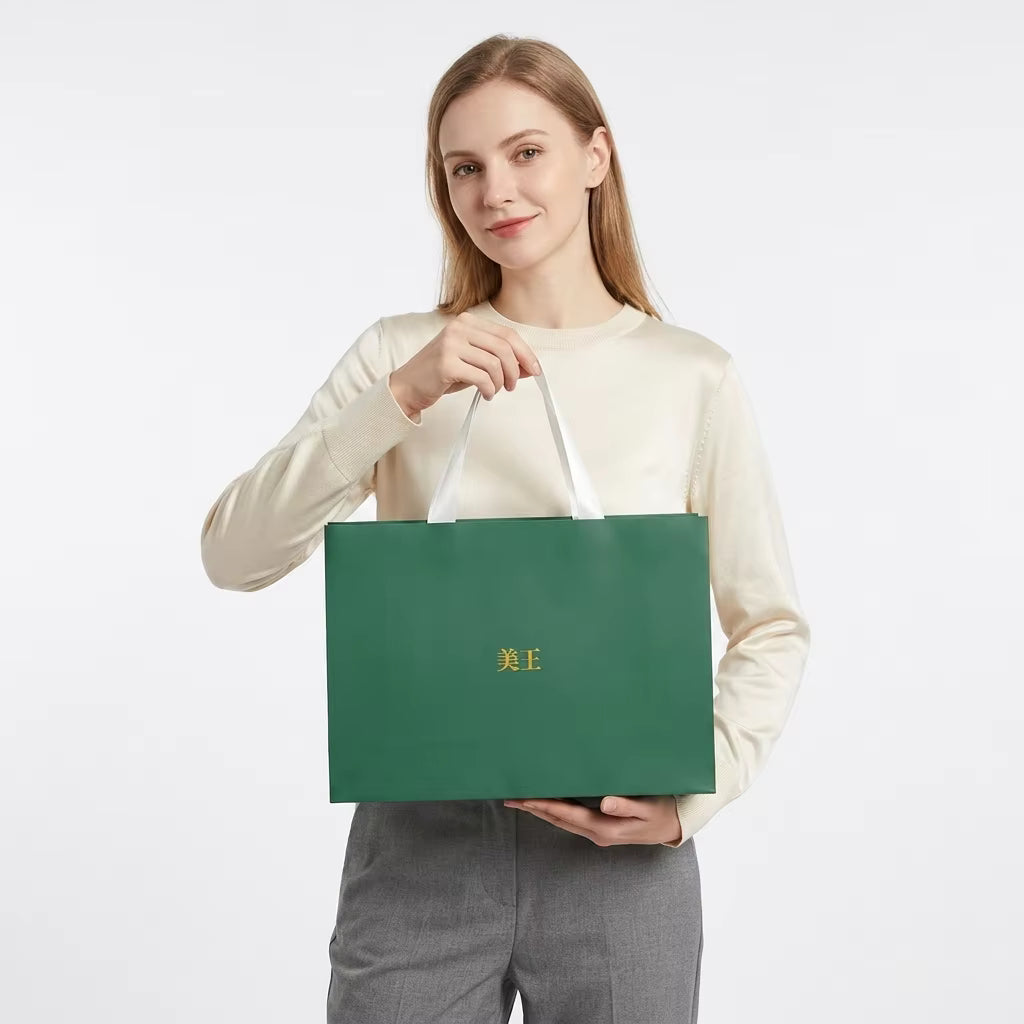 Custom Coated Paper Gift Bags with Logo, 250gsm Glossy Art Paper Shopping Bags with Ribbon Handles for Luxury Brand